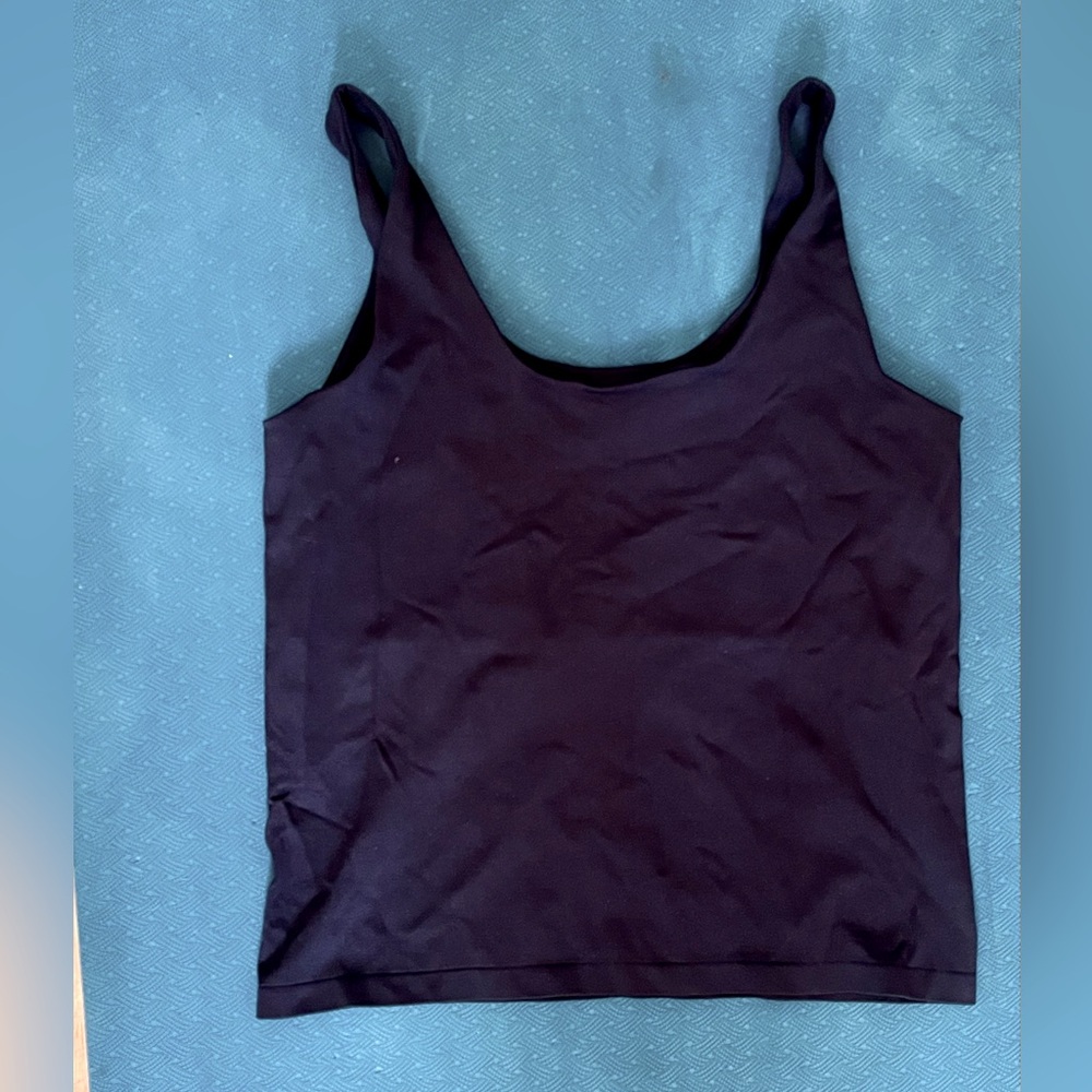 4 pack of Avec Les Filles tank tops